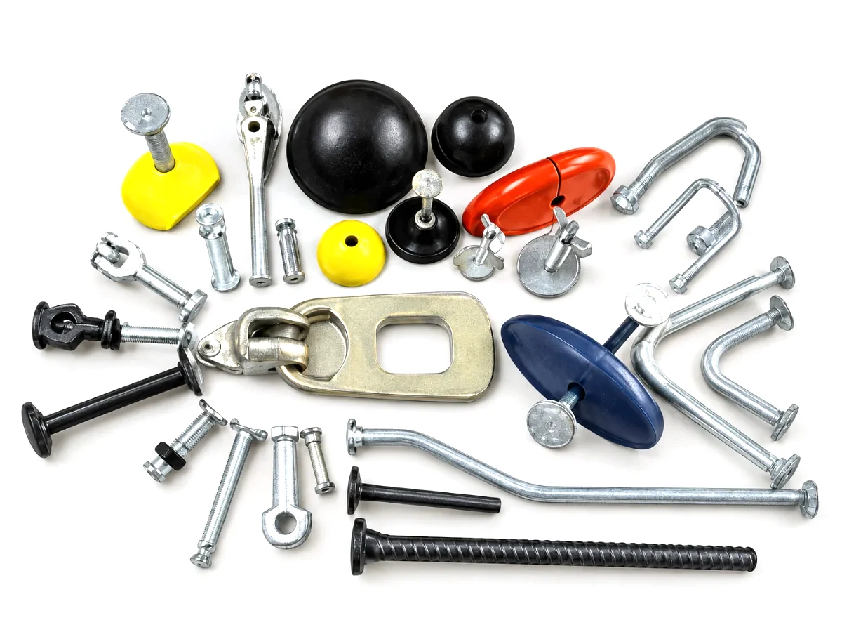 Pin anchor lifting system for precast concrete: lifting clutch, spherical head anchors and rubber recess formers
